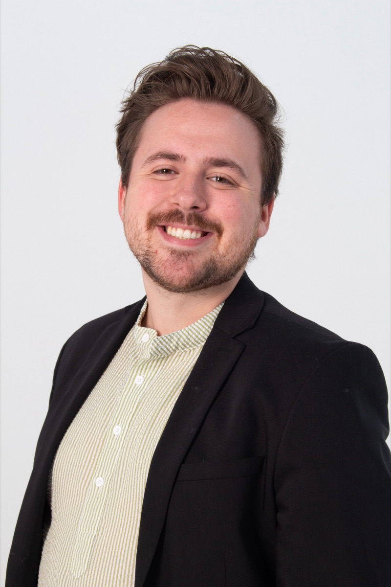 Portrait of Nathan Agle, Partner and Director of Marketing